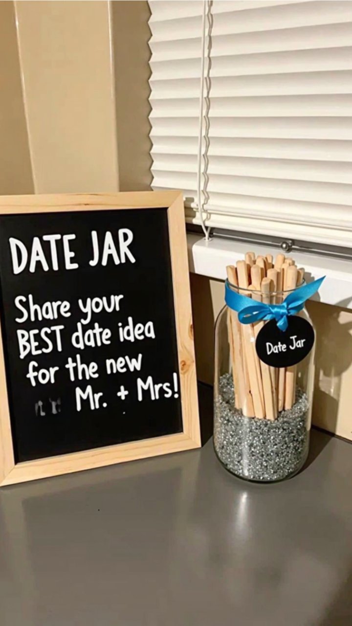 Bridal shower date night idea with popsicle sticks in a decorated mason jar for guests to write fun date suggestions.
