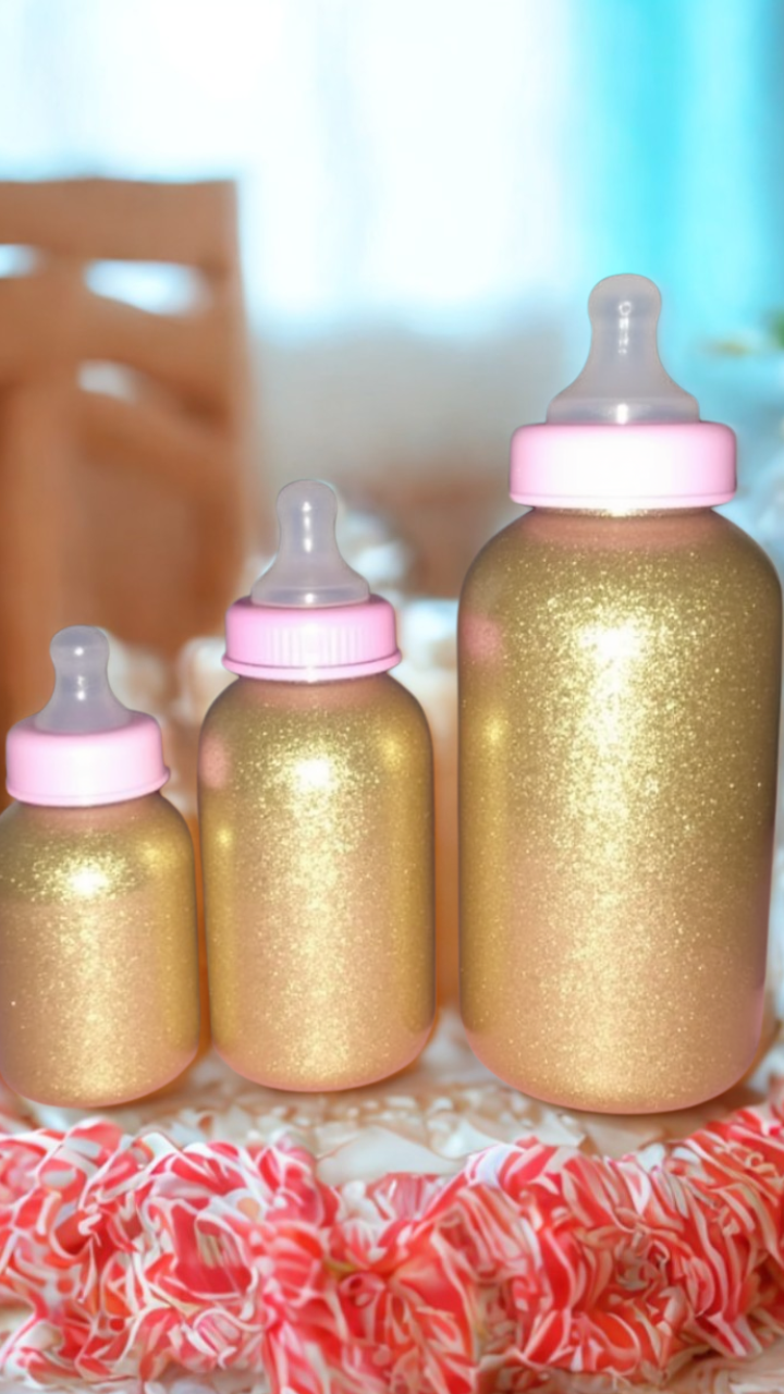 Gold glitter-decorated baby shower bottles