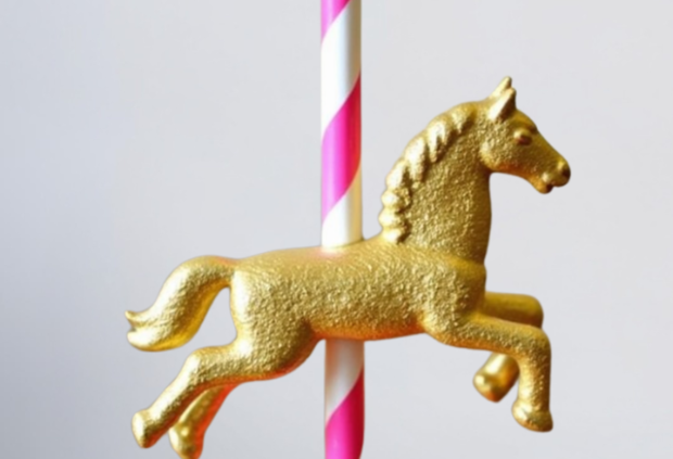 DIY carousel-themed baby shower centerpiece with gold horse and paper straw