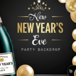 Champagne bottle balloon backdrop with gold balloons rising like bubbles for New Year’s Eve party decor