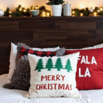Bed with Christmas pillows, garland on headboard, and mini Christmas tree.